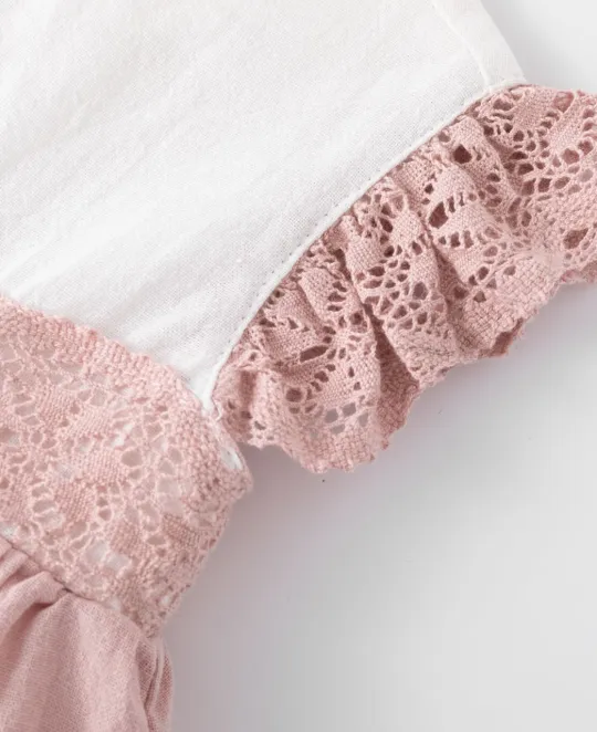 Pink knit garment with ruffled lace trim detail