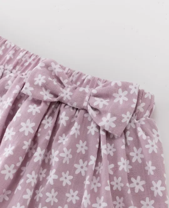 Purple floral patterned shorts with elastic waistband and drawstring tie