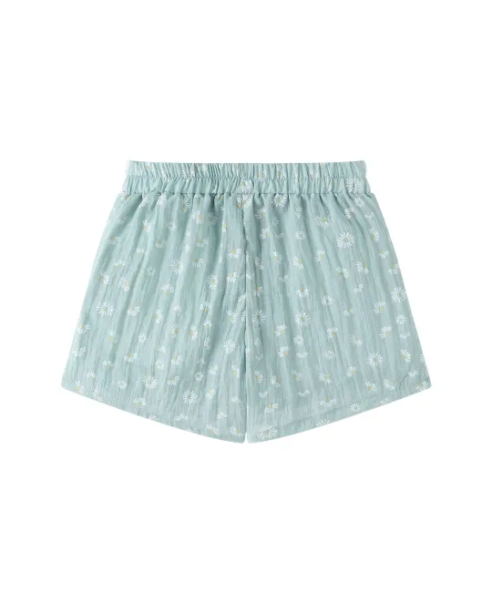 Light blue boxer shorts with white polka dot pattern and elastic waistband