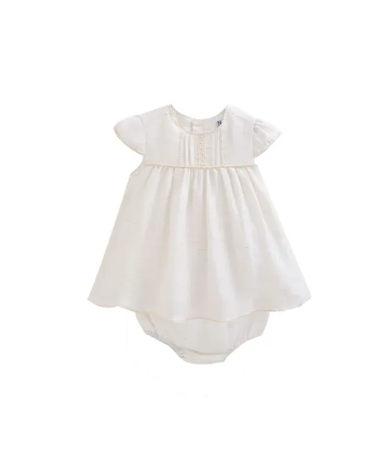 White baby dress with smocked detail and matching diaper cover