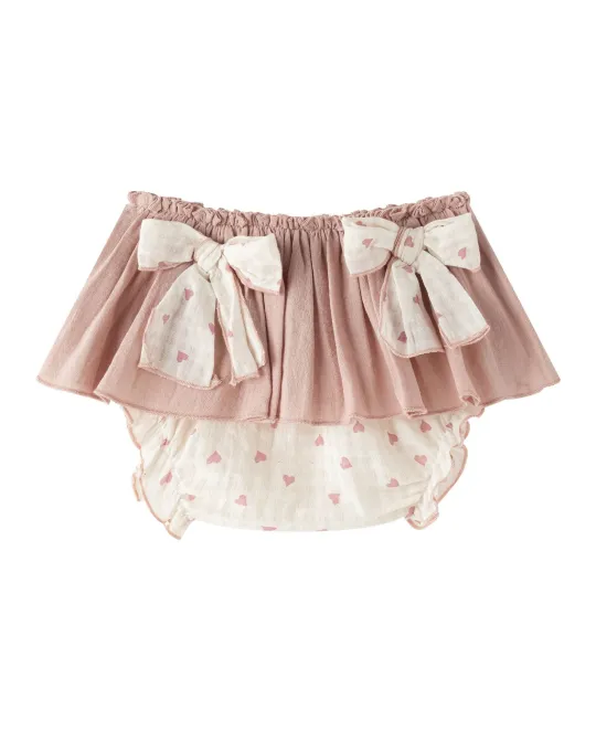 Pink ruffled bloomer with white lace trim and bow details