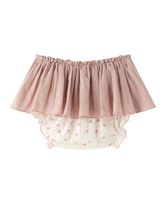 Pink bloomers with white lace trim underneath