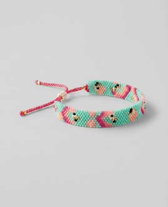 Turquoise beaded bracelet with pink flowers and adjustable pink cord closure