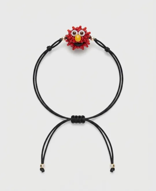 Black cord bracelet with red crystal cluster centerpiece and adjustable sliding closure