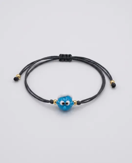 Black cord bracelet with blue evil eye charm