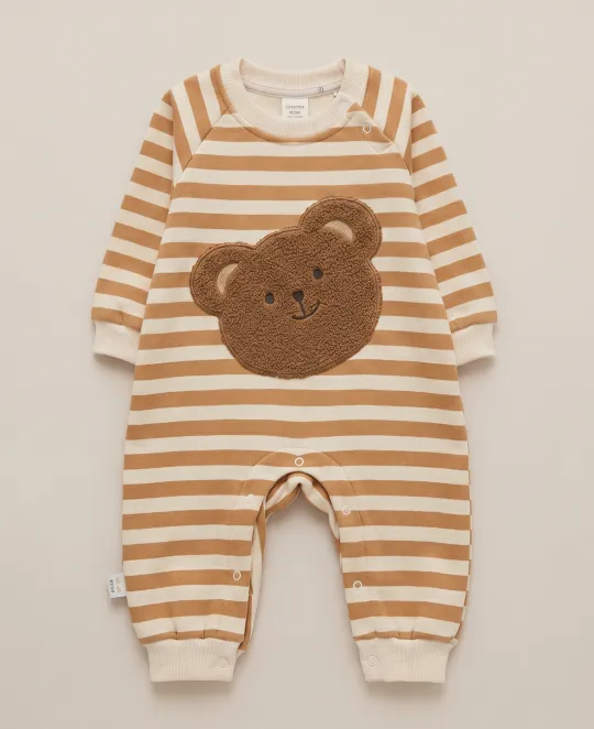 Long-sleeved brown and white striped baby romper with teddy bear applique on chest