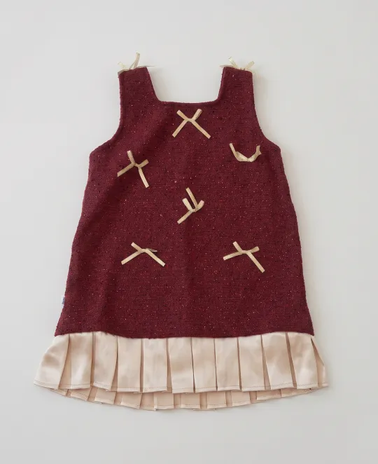 Burgundy jumper dress with embroidered dragonflies over plaid ruffle hem top