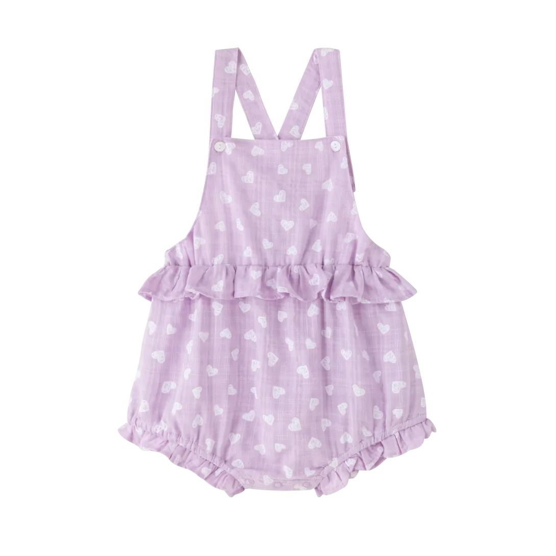 Lavender polka dot baby romper with shoulder straps and ruffled leg openings