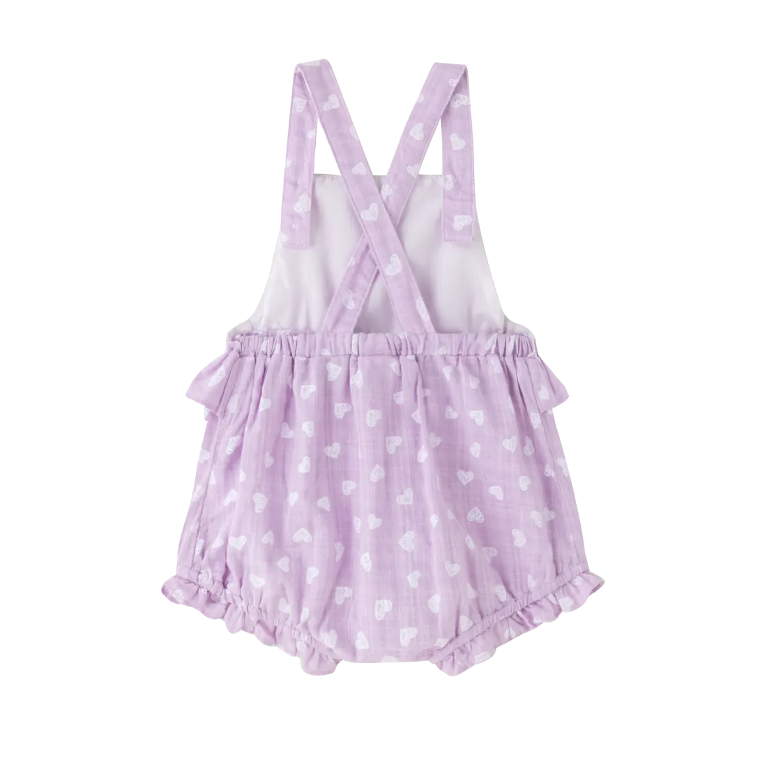 Lavender baby romper with white polka dots and ruffled leg openings