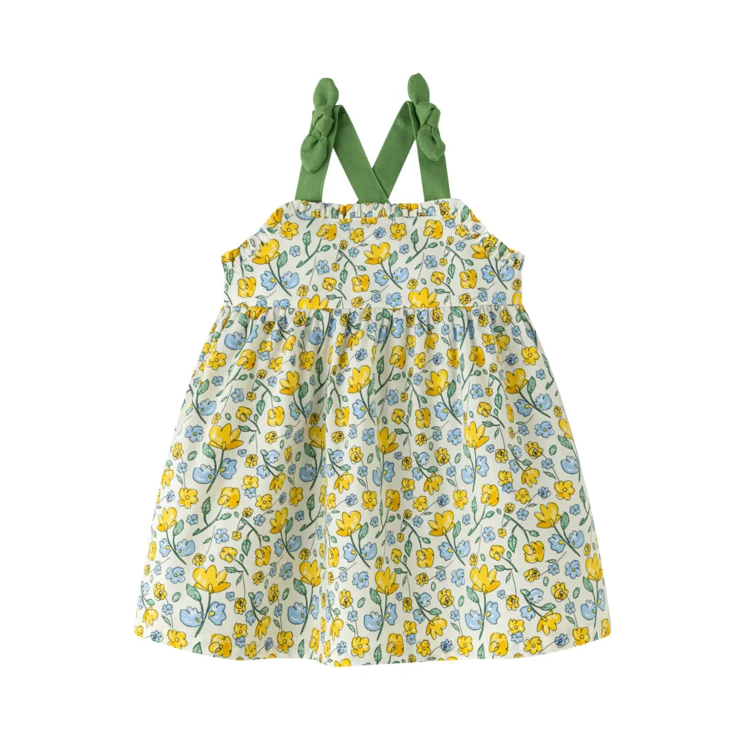 Toddler dress with green shoulder straps and yellow floral print on white background