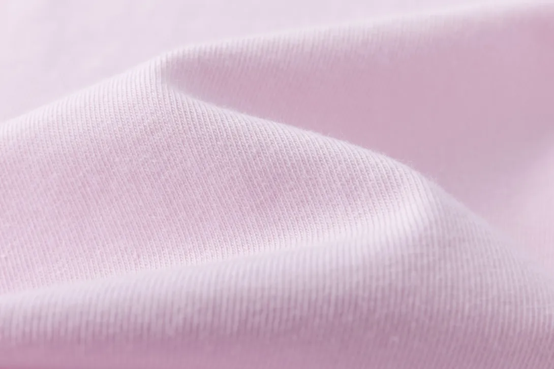 Light pink fabric with soft texture and gentle folds