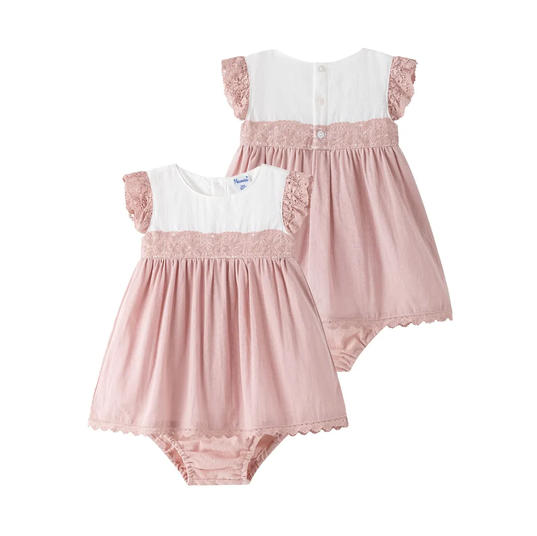 Pink baby romper with white contrasting top and ruffle sleeves shown front and back