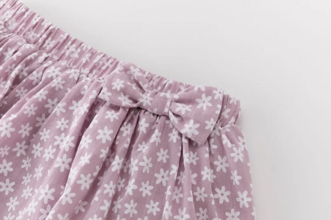 Purple floral patterned shorts with elastic waistband and drawstring tie