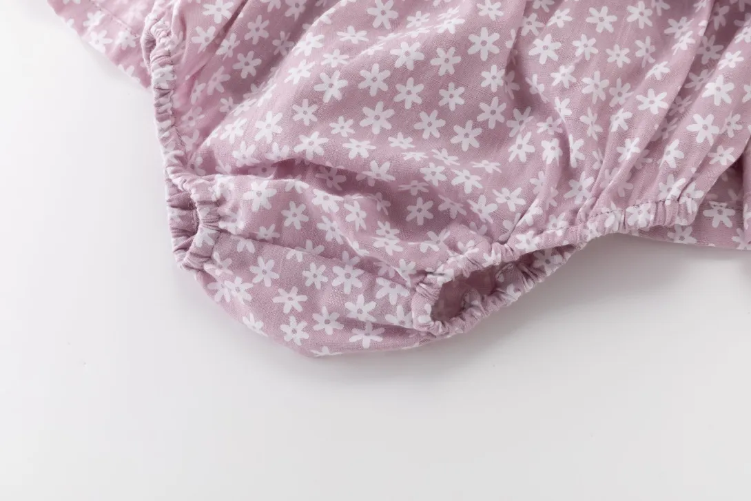 Purple floral print baby bloomers with elastic waistband and leg openings