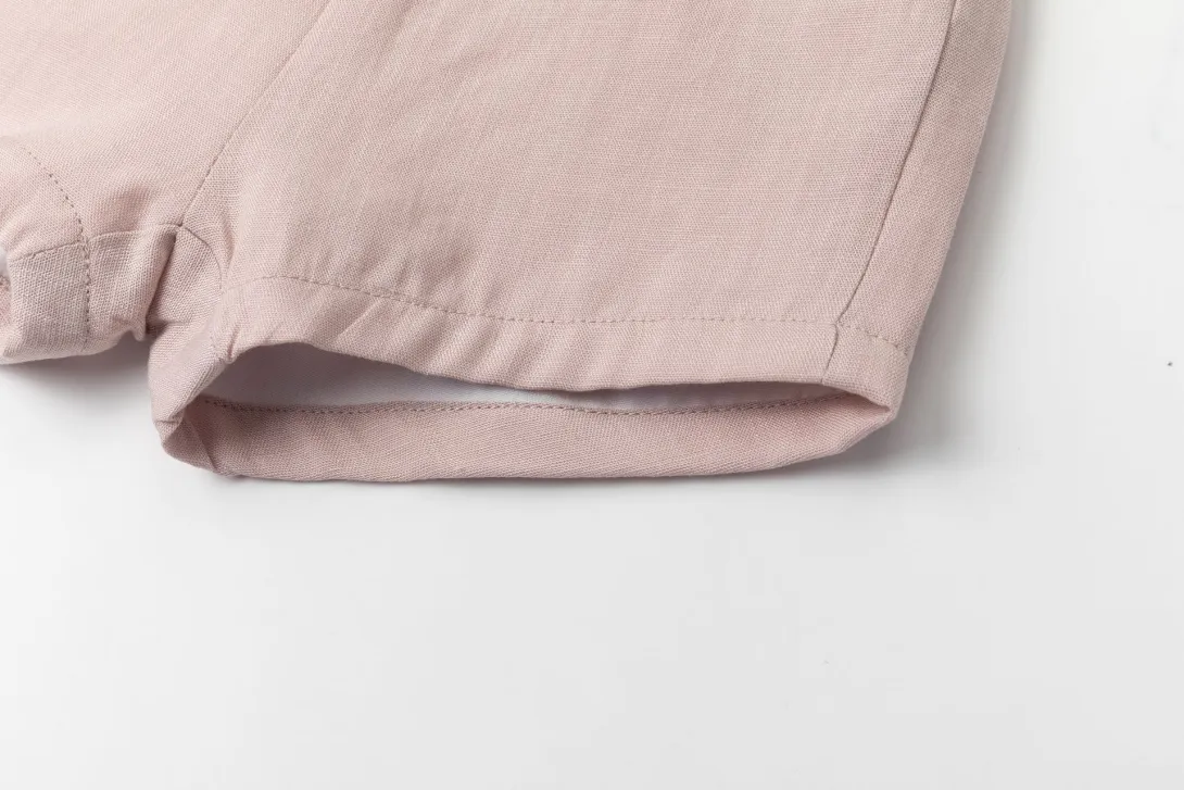 Light pink pants leg with folded hem detail
