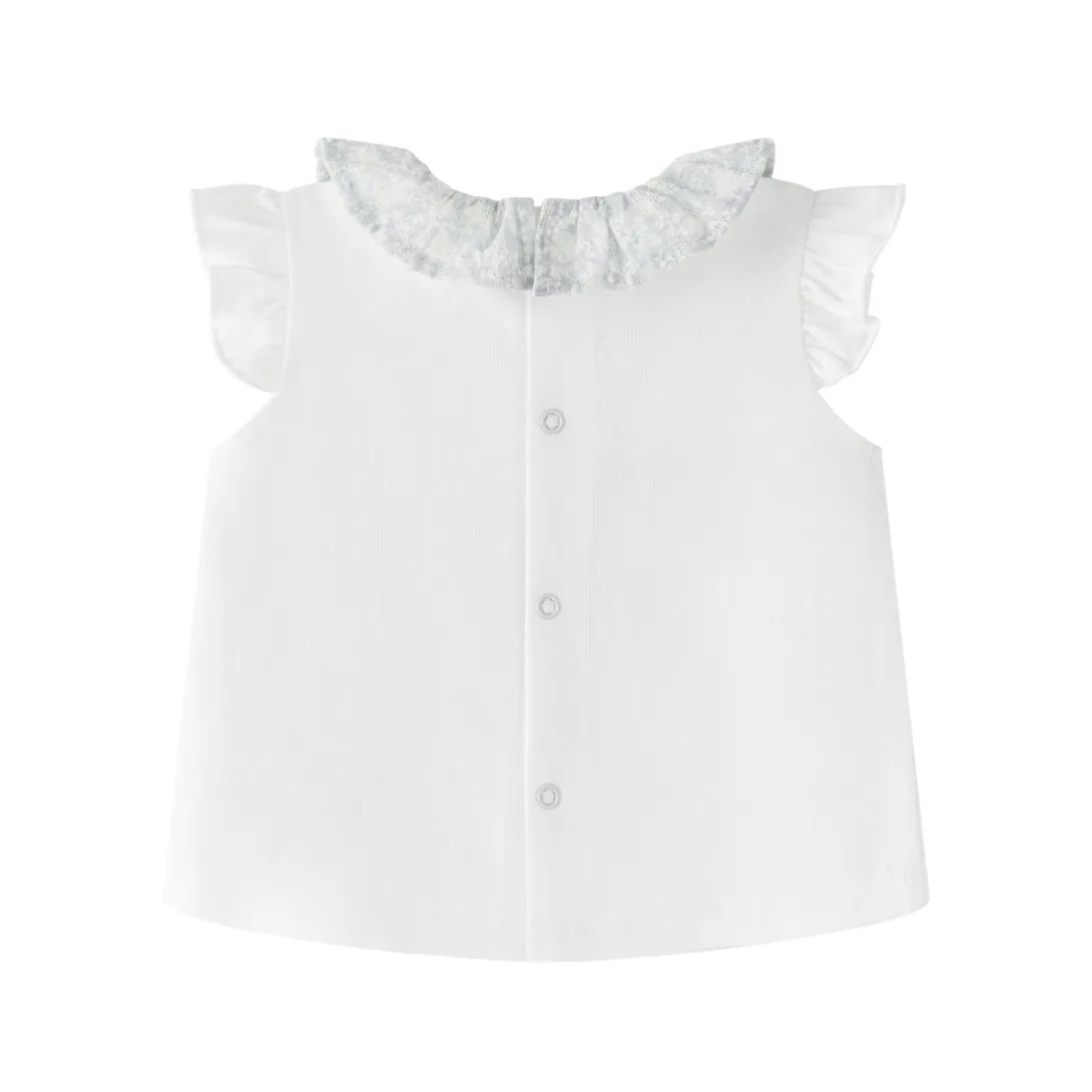 White baby blouse with ruffled collar and flutter sleeves