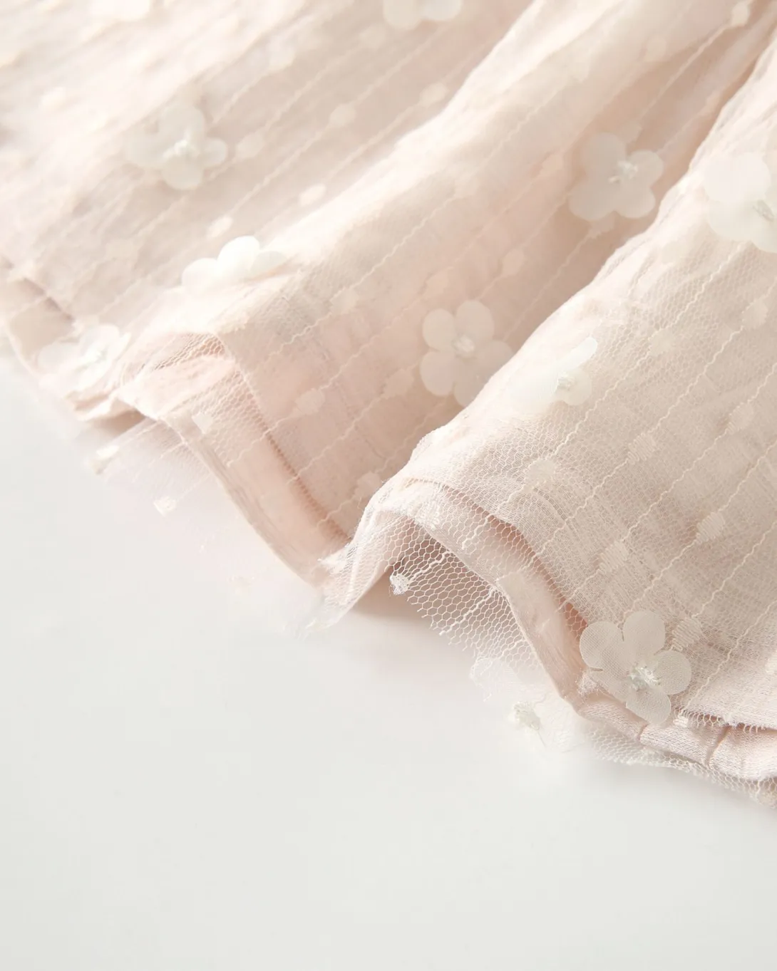 Light pink faux fur slippers with white fluffy lining