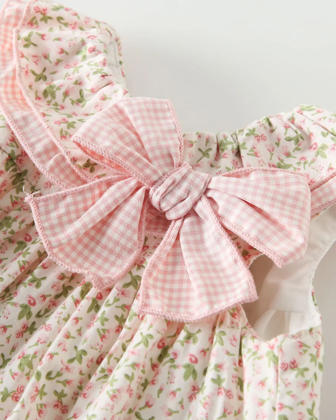 Pink gingham bow sash on floral print dress