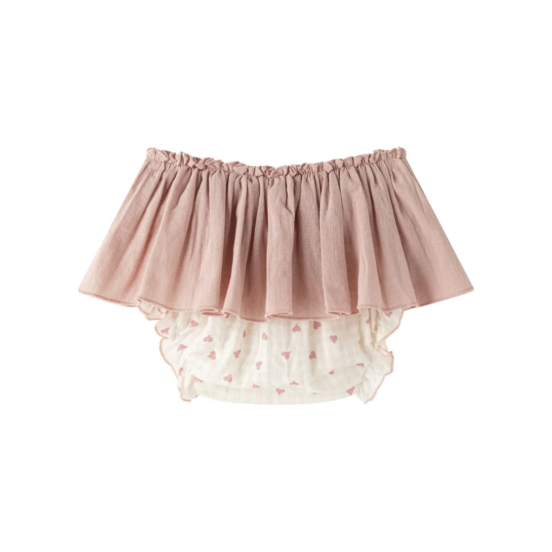 Pink bloomers with white lace trim underneath
