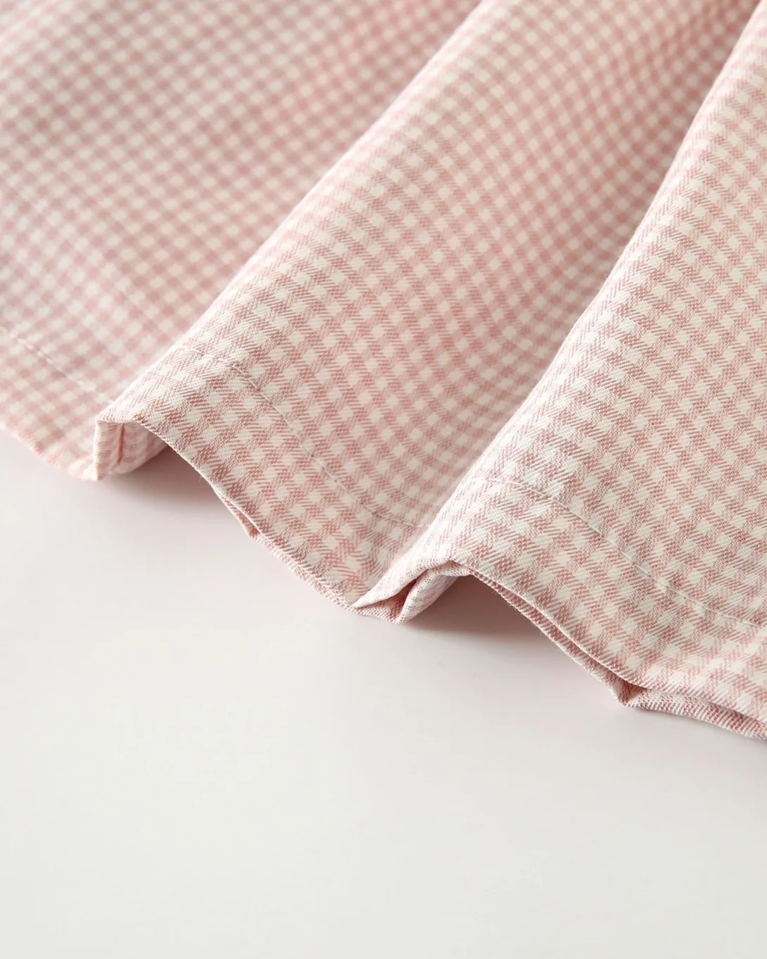 Pink and white gingham check fabric with textured weave