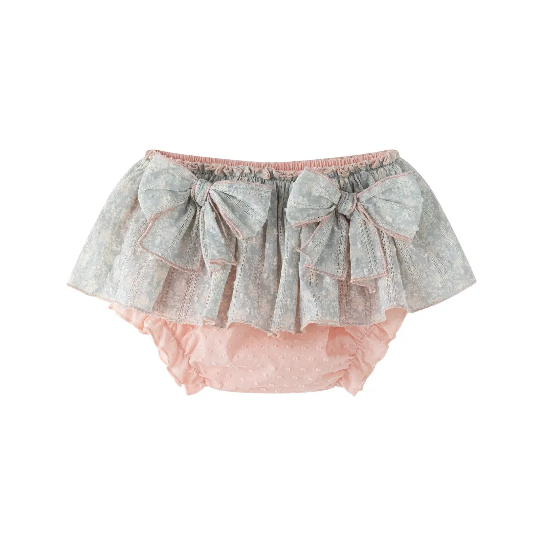 Baby diaper cover with gray floral skirt overlay and peach ruffled trim