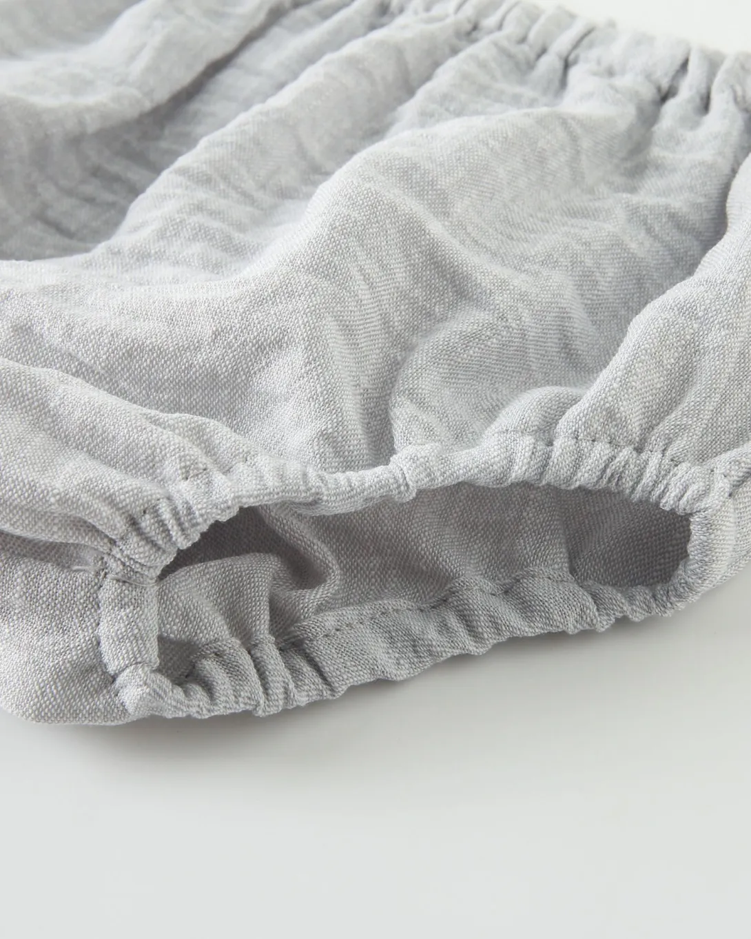Gray gathered fabric cuff with elastic detail