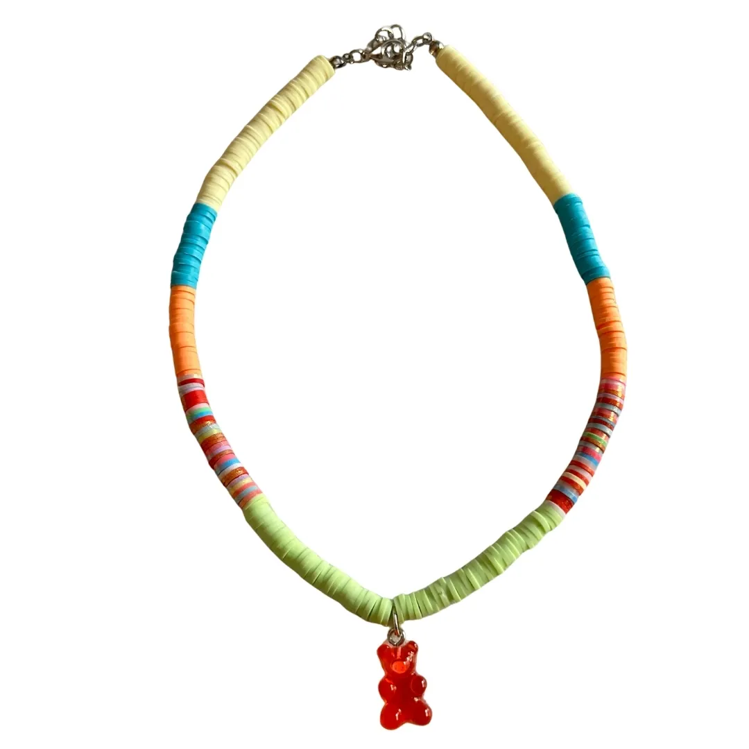 Colorful beaded necklace with multicolor segments and red gummy bear pendant
