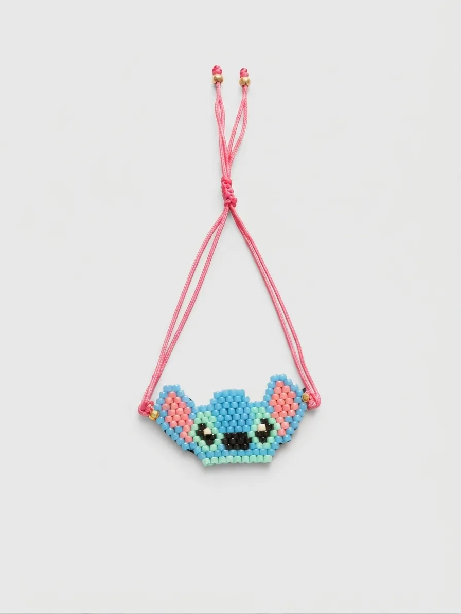 Blue character face necklace with pink cord