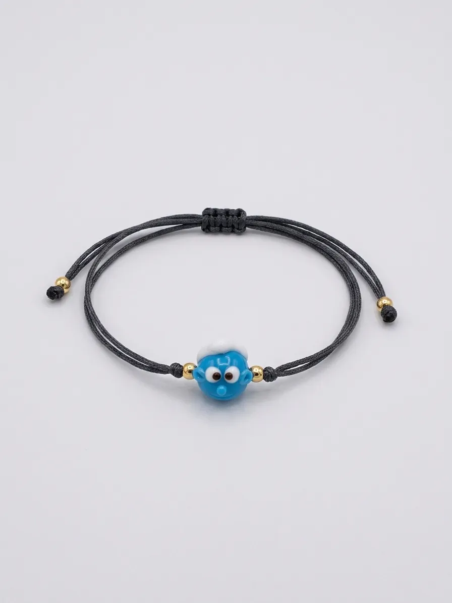 Black cord bracelet with blue evil eye charm
