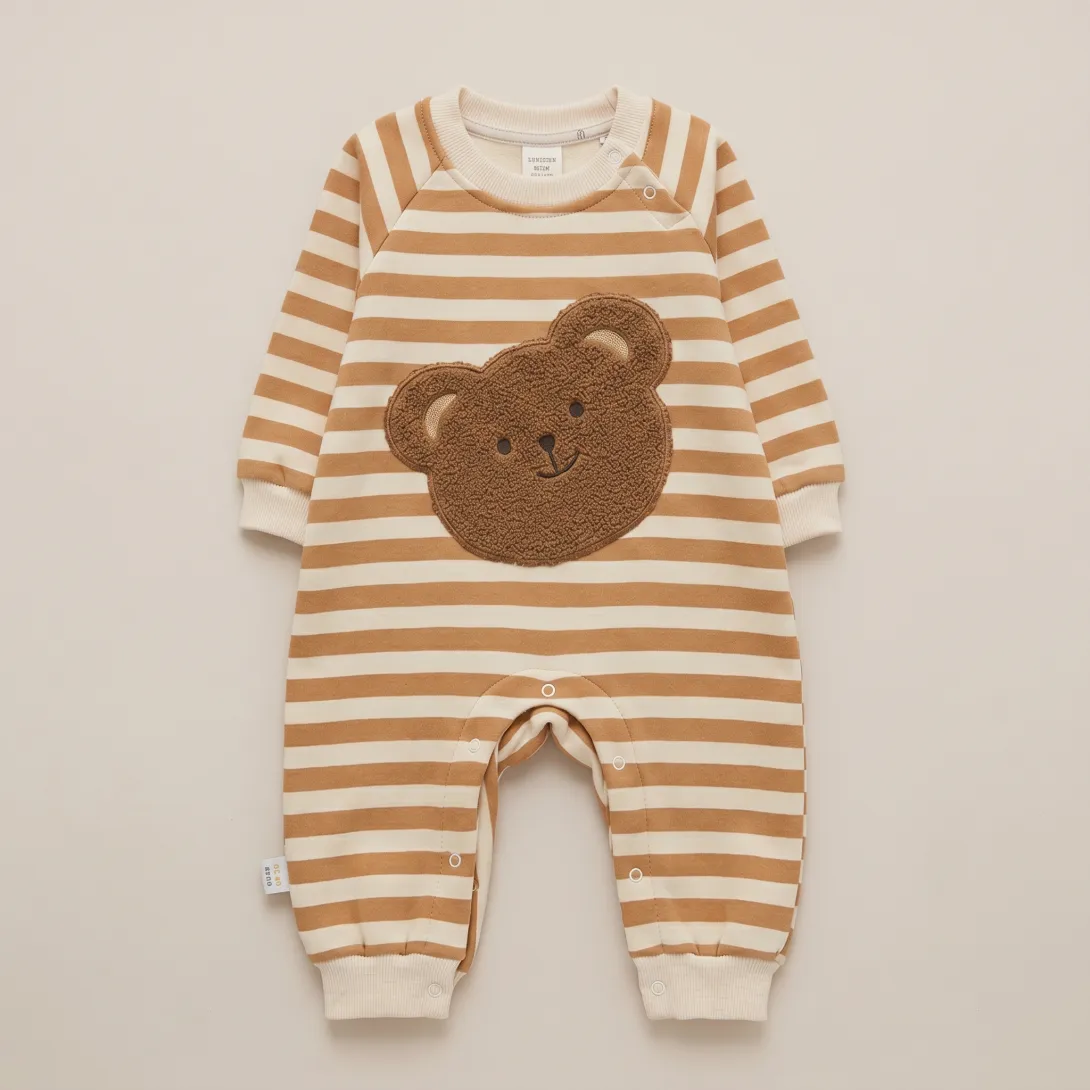 Long-sleeved brown and white striped baby romper with teddy bear applique on chest