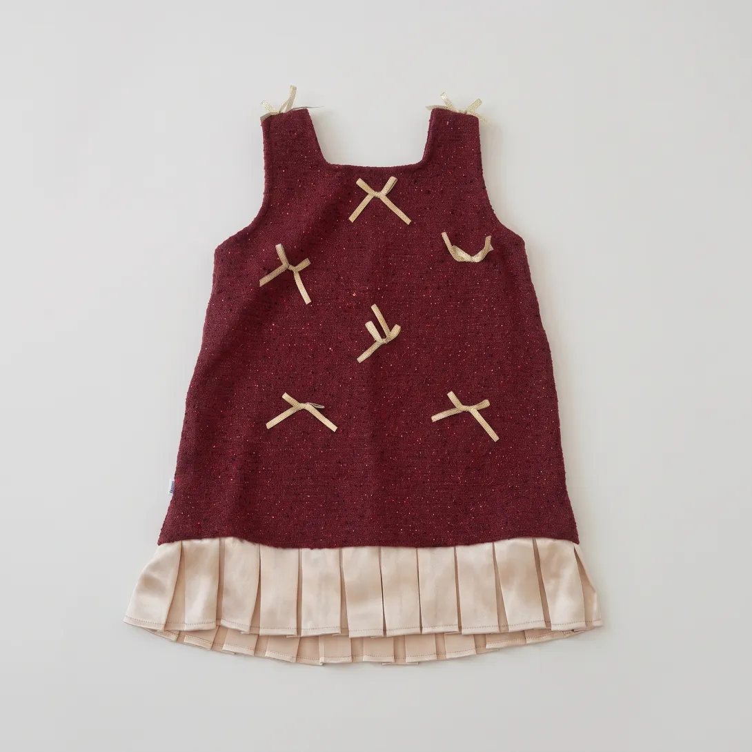 Burgundy jumper dress with embroidered dragonflies over plaid ruffle hem top