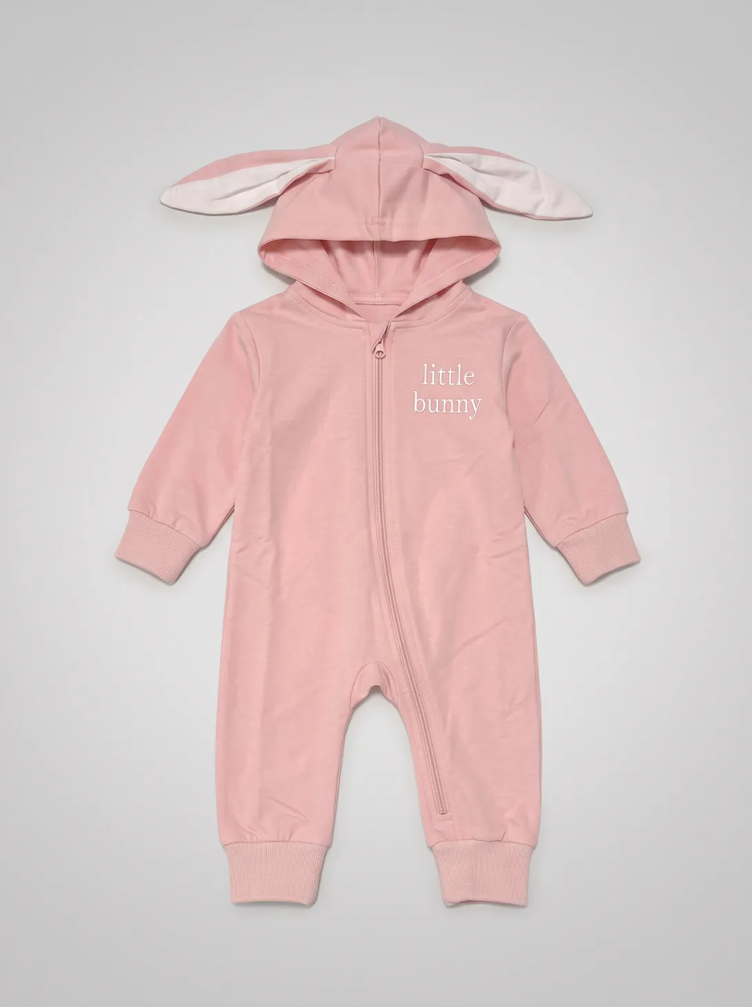 Pink hooded romper with bunny ears on hood